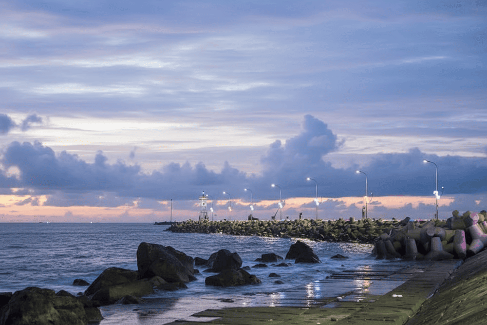 Perched on a rocky outcrop above the sea, the temple offers a stunning front-row view of the sun melting into the ocean horizon